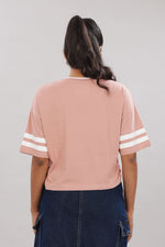 Pink cotton boxy top for women with extended sleeves by Outlaws Fashion, shown on a model with a relaxed fit.