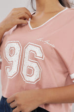 Printed pink cotton boxy top for women with extended sleeves by Outlaws Fashion, shown flat on a white background.