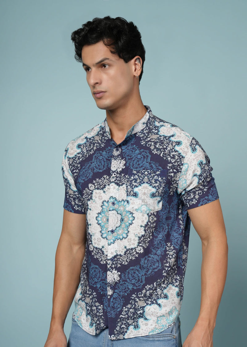 Men’s blue printed rayon shirt by Outlaws Fashion, featuring soft fabric and stylish casual design, shown on a hanger.