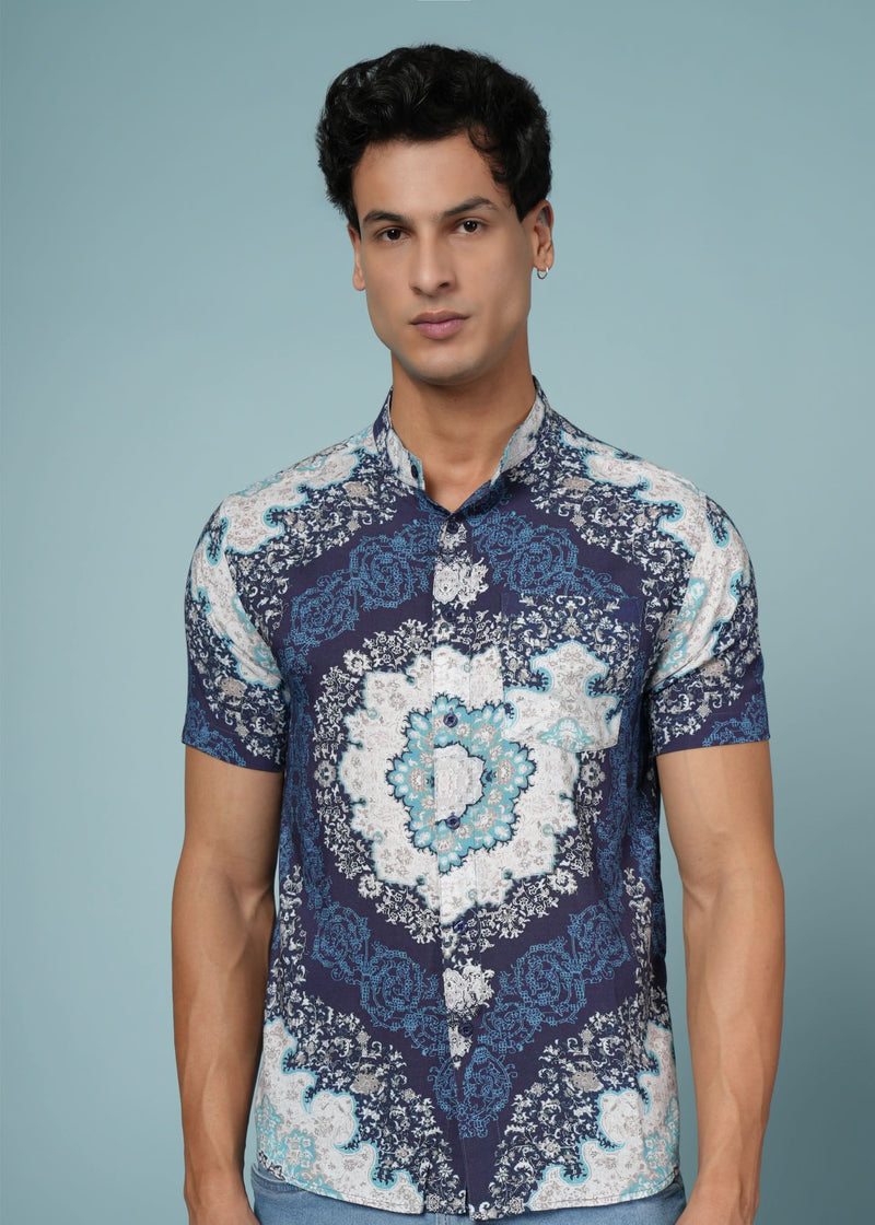 Men's blue printed rayon shirt from Outlaws Fashion, featuring soft fabric and stylish casual design, displayed on a hanger.