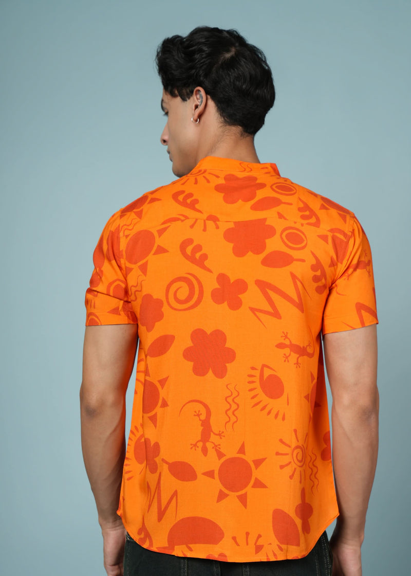 Men’s tribal art print rayon shirt by Outlaws Fashion, featuring bold, vibrant colors and casual style, displayed on a hanger.