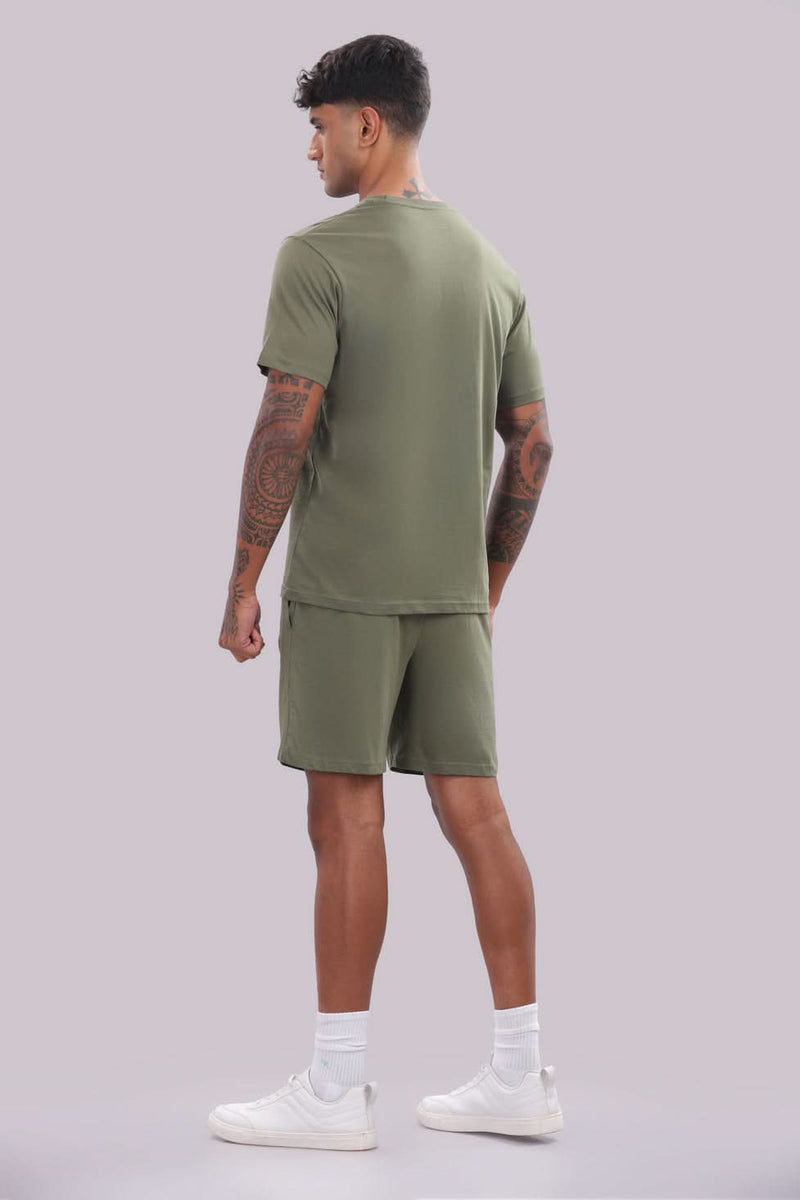 Men’s olive green co-ord set from Outlaws Fashion, featuring a comfortable matching sweatshirt and joggers for everyday wear.