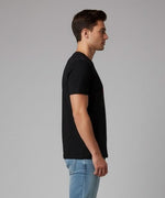 Men’s Outlaws Christmas printed T-shirt with festive design, 100% cotton casual wear, featuring holiday-themed graphics.