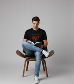 Men's Outlaws Christmas printed T-shirt featuring festive holiday design, made from 100% cotton for casual winter wear.