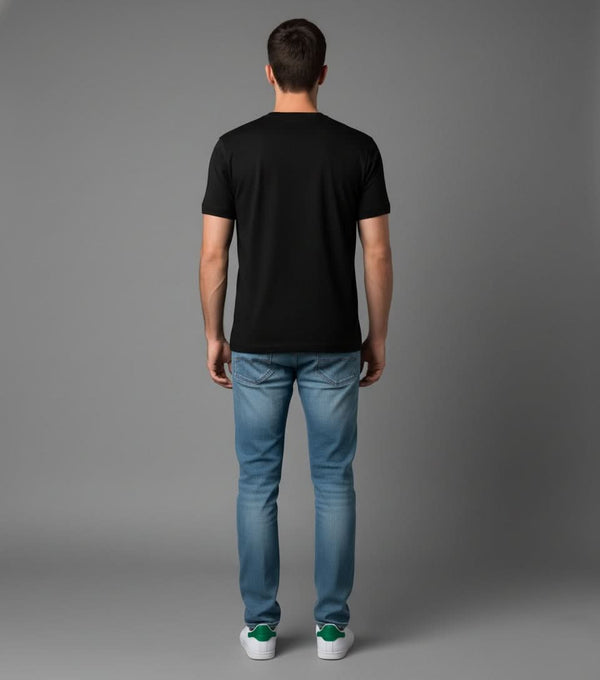Men’s Outlaws Christmas printed T-shirt featuring festive holiday design and 100% cotton casual wear, shown on a model.