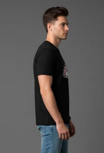 Men’s Outlaws Christmas printed T-shirt showcasing festive holiday design, 100% cotton casual wear for men.