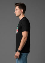 Men’s Outlaws Christmas printed T-shirt featuring festive holiday design and 100% cotton casual wear, shown in the image.