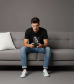Men’s Outlaws Christmas printed T-shirt with festive design, 100% cotton casual wear, featuring holiday-themed graphics.