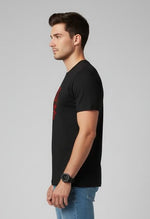 Men’s Outlaws Christmas printed T-shirt featuring festive holiday design, 100% cotton casual wear with seasonal graphics.
