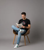 Men’s Outlaws Christmas printed T-shirt featuring festive holiday design, made of 100% cotton for casual winter wear.