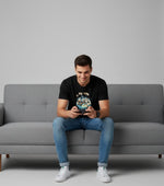 Men’s Outlaws Christmas printed T-shirt featuring festive holiday design and 100% cotton fabric, casual wear for men.