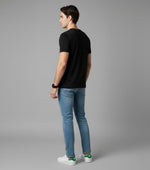 Men’s Outlaws Christmas printed T-shirt featuring festive holiday design and 100% cotton casual wear, with bold graphics and colors.