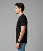 Men’s Outlaws Christmas printed T-shirt featuring festive holiday design, 100% cotton casual wear, with colorful holiday-themed print.