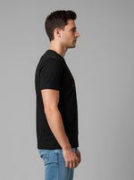 Men’s Outlaws Christmas printed T-shirt featuring festive holiday design, 100% cotton casual wear, with colorful seasonal print.