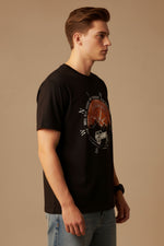 Men’s Outlaws printed cotton T-shirt with casual fit, featuring bold graphic design and short sleeves.