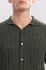 Olive green men's 100% cotton knitted button-down shirt by Outlaws Fashion, showing the collar and front buttons.