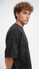 Black acid wash men's T-shirt featuring a relaxed fit, showcasing the Outlaws design on a virtual photoshoot.