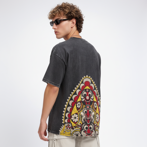 Black acid wash men's T-shirt featuring a vintage-inspired design, styled casually for a rugged, edgy look.