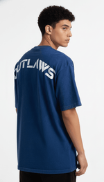 Men's Outlaws Acid Wash Blue T-Shirt with vintage-inspired design, casual fit, and distressed detailing on a neutral background.