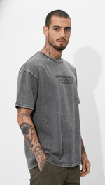 Men's Outlaws Acid Wash Grey T-Shirt from My Store, featuring a casual fit and distressed design, shown in a virtual photoshoot.