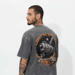 Men's grey acid wash T-shirt from Outlaws, styled for casual wear, shown on a virtual photoshoot background.