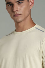 Outlaws Fashion beige men's athleisure T-shirt with a relaxed fit, crew neck, and soft fabric for comfortable casual wear.