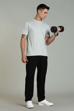 Light grey men's athleisure T-shirt by Outlaws Fashion, casual fit, soft fabric, displayed on a hanger.