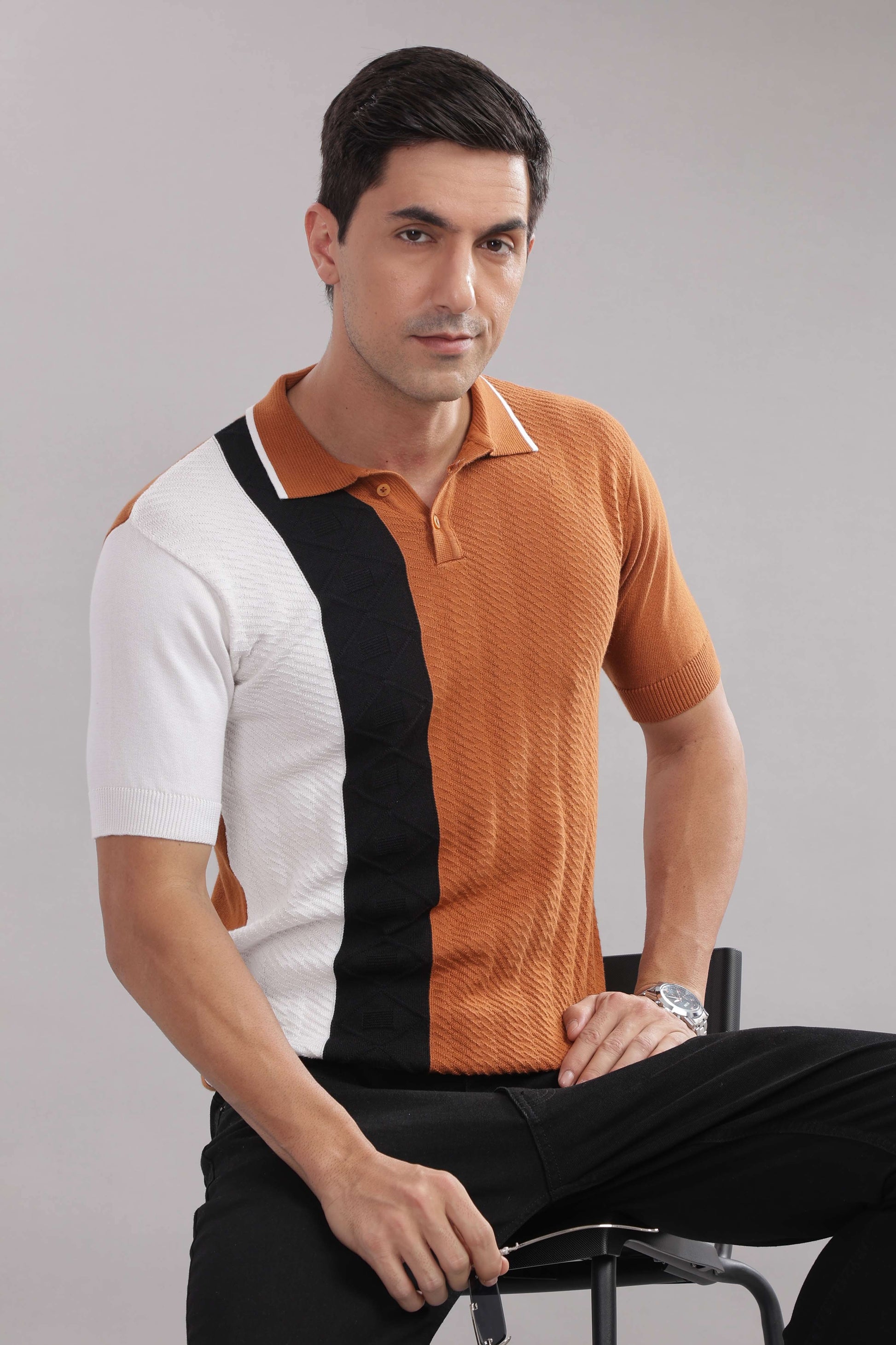 Men’s cotton colour-block knitted polo shirt in rust, black, and white by Outlaws Fashion, showing front view and collar detail.