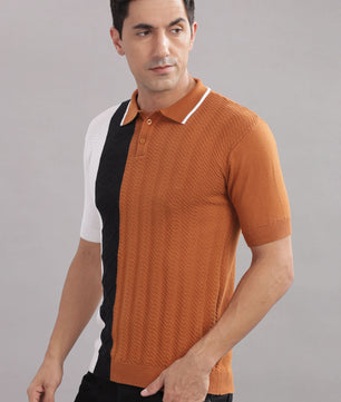 Men's cotton colour-block knitted polo shirt in rust, black, and white by Outlaws Fashion, shown in a close-up of the fabric and design.