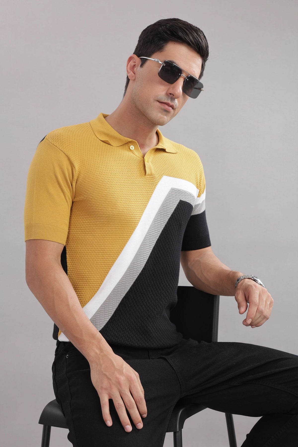 Stylish men's cotton colour-block knitted polo T-shirt in mustard, black, and grey from Outlaws Fashion, displayed on a mannequin.