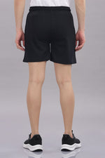 Men's Outlaws Shorts by Outlaws Fashion, casual denim shorts with distressed details, shown on a model.