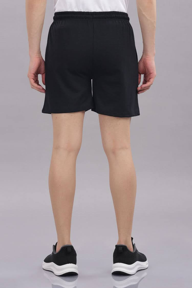Men's Outlaws Shorts by Outlaws Fashion, casual denim shorts with distressed details, shown on a model.