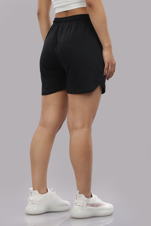 Outlaws Fashion women's shorts with a casual fit and distressed details, shown in a relaxed style on a model.