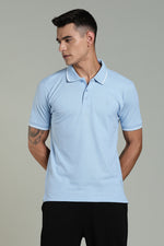 Men's sky blue polo T-shirt by Outlaws Fashion, featuring a classic collar and short sleeves, laid flat on a white background.