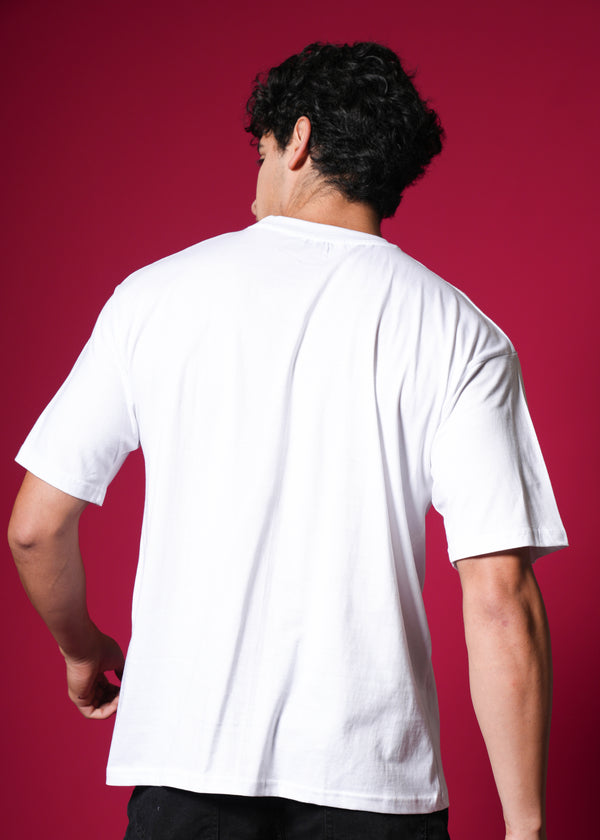 White oversized T-shirt by Outlaws Fashion featuring a 100% cotton streetwear design, displayed on a hanger.