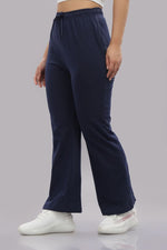 Navy blue women's track pants by Outlaws Fashion, featuring a comfortable fit and sporty design, shown on a model.