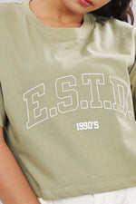 Printed olive cotton boxy top for women with extended sleeves by Outlaws Fashion, shown on a model with a relaxed fit.