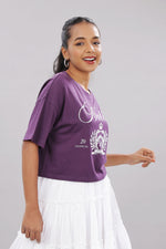 Printed purple cotton boxy top for women with extended sleeves, featuring bold floral print and relaxed fit.